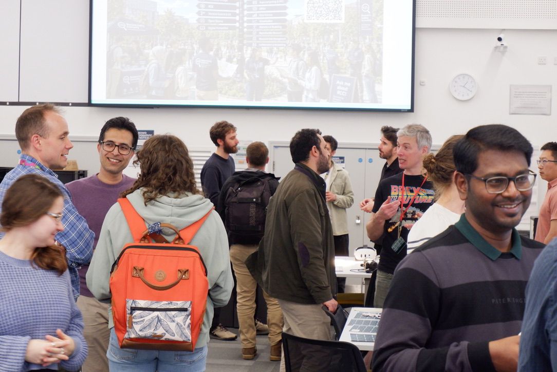 Research Coding Community Fair event photo showing people taking part in the fair